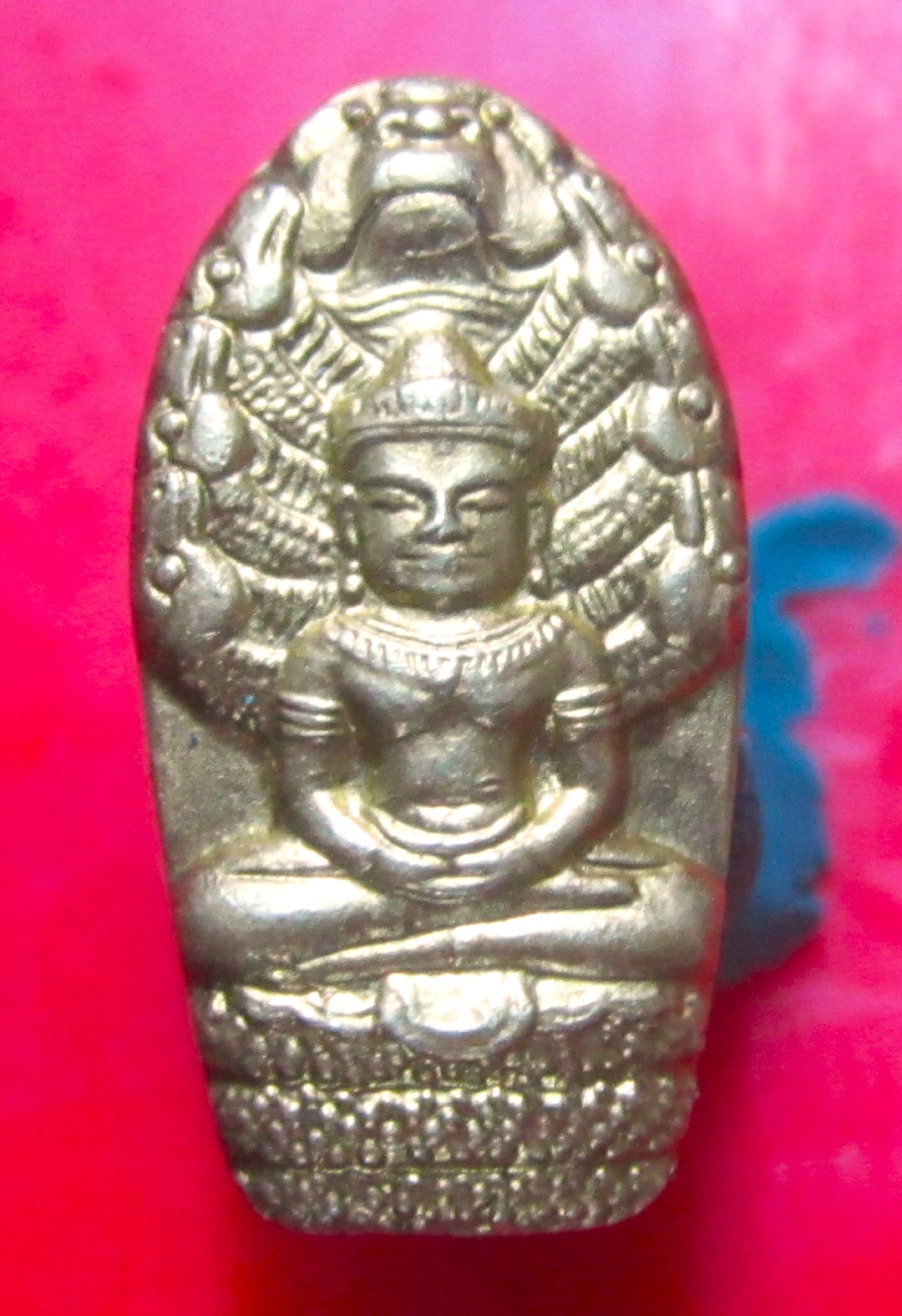 เหรียญ พระนาคปรก ใบมะขาม หลังยันต์ครึ่งใบ จารมือ ไม่ทราบที่