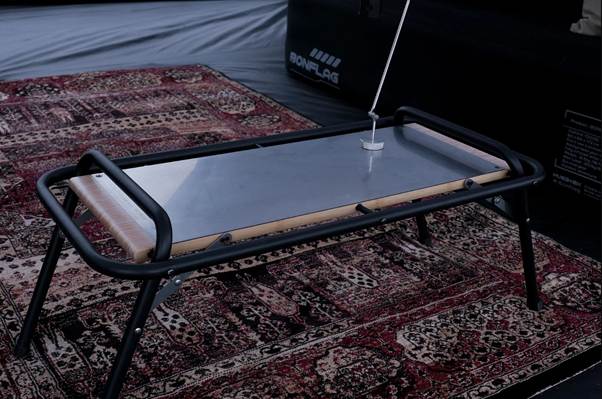 A table on a rug

AI-generated content may be incorrect.
