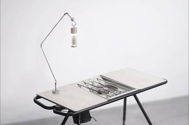 A table with a lamp on it

AI-generated content may be incorrect.