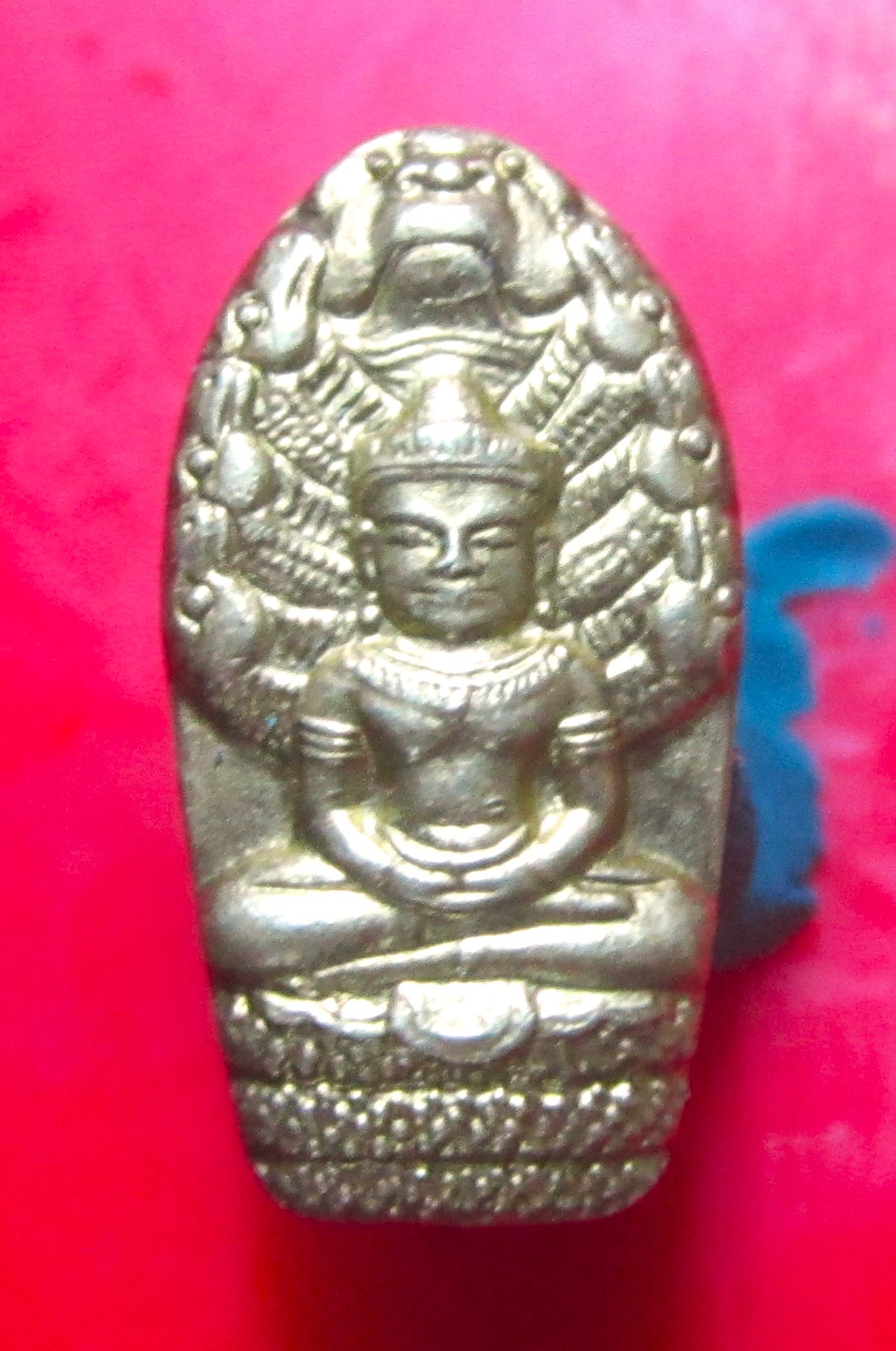 เหรียญ พระนาคปรก ใบมะขาม หลังยันต์ครึ่งใบ จารมือ ไม่ทราบที่