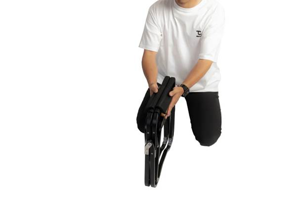 A person holding a chair

AI-generated content may be incorrect.