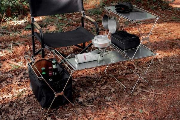 A table with a portable stove and a chair

AI-generated content may be incorrect.
