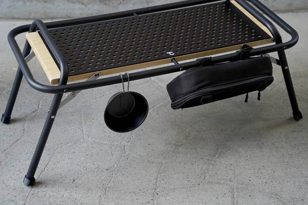A black bag on a metal table

AI-generated content may be incorrect.