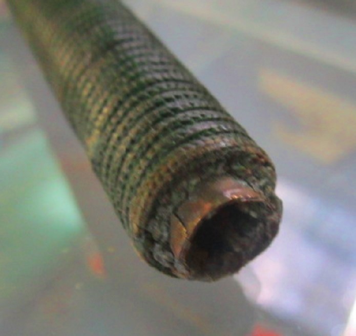 เครื่องรางของขลัง ตะกรุดโทน เนื้อทองแดง ยาว3นิ้ว ครึ่ง หุ้มเชือกร่มสีเขียว เก็บหัวท้าย ไม่ทราบที่