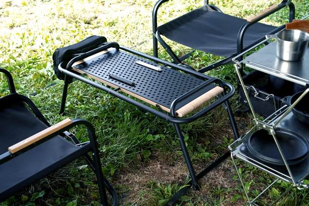 A table and chairs on grass

AI-generated content may be incorrect.