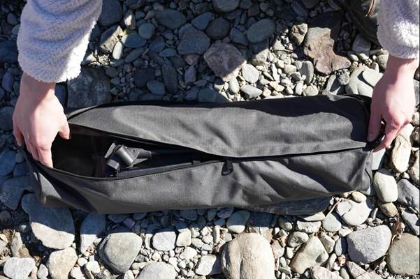 A person holding a black bag

AI-generated content may be incorrect.