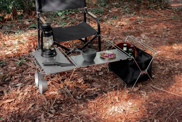 A table with a camping chair and a lantern

AI-generated content may be incorrect.