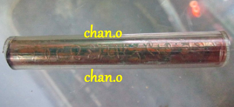 ตะกรุดม้วนจารเต็ม เนื้อทองแดง ยาว 2.7นิ้ว หุ้มด้วยท่อยาง ไม่ทราบที่