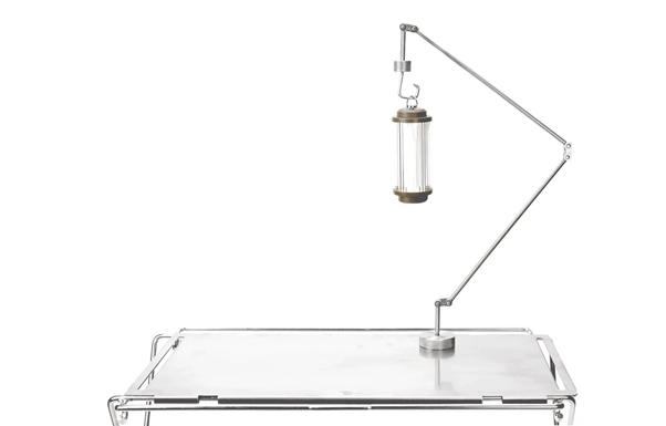 A metal stand with a clear tube on it

AI-generated content may be incorrect.