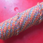 ตะกรุดผ้าม้วน ยาว2นิ้ว เชือกแดงคล้องคอ ไม่ทราบที่ อันที่2